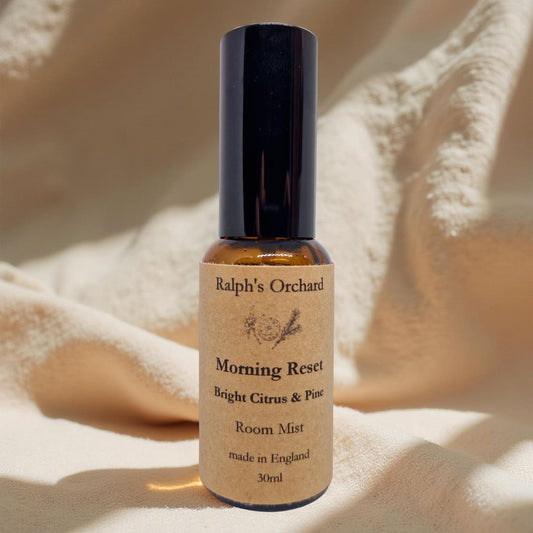 Bottle of Ralph's Orchard 'Morning Reset' room mist on a textured beige background