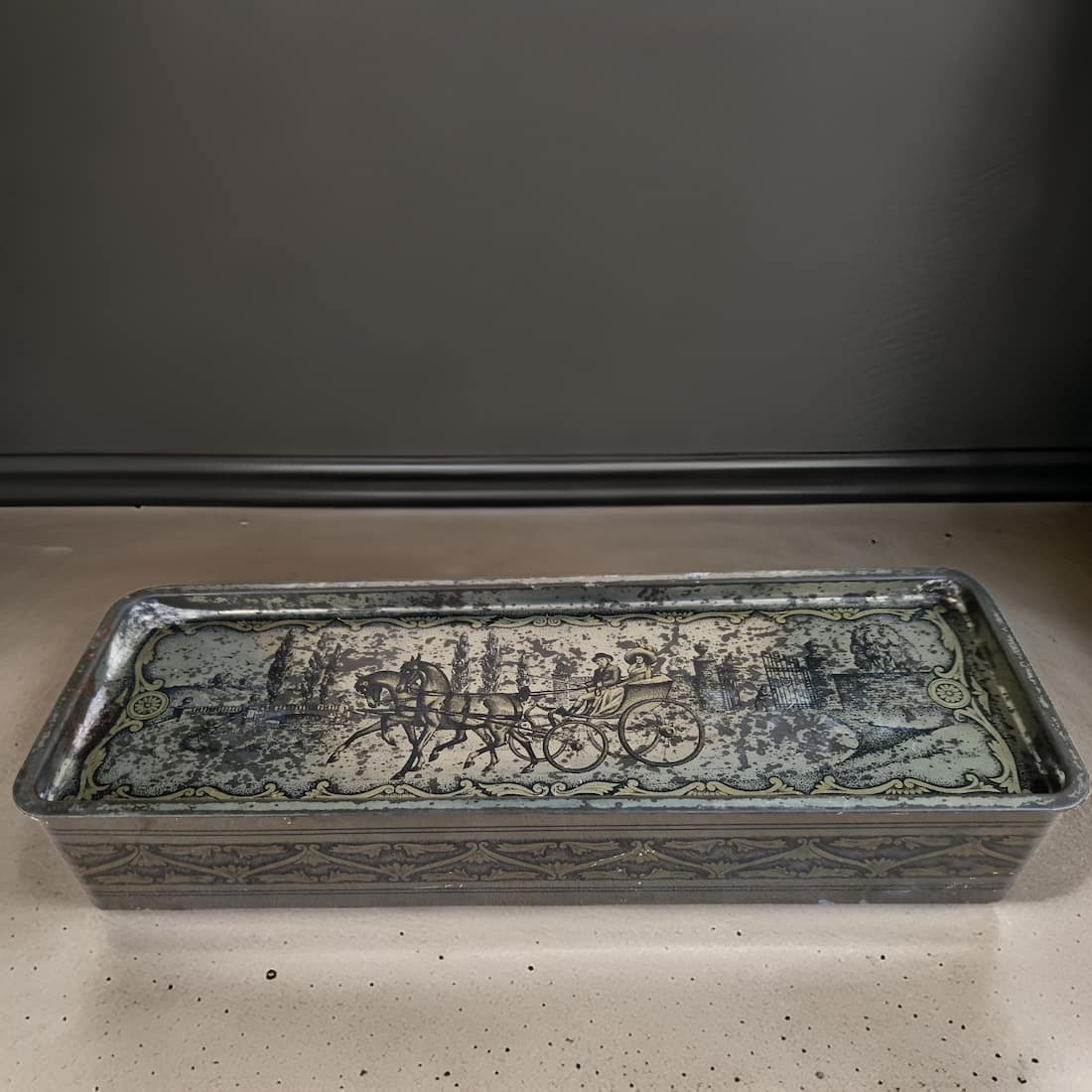 Decorative stone trough with intricate carvings on a neutral background