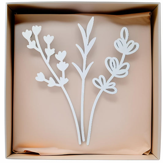 White floral cutouts in a cardboard box