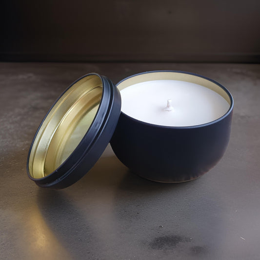 Eco-friendly vegan scented soy candles in luxury black tins