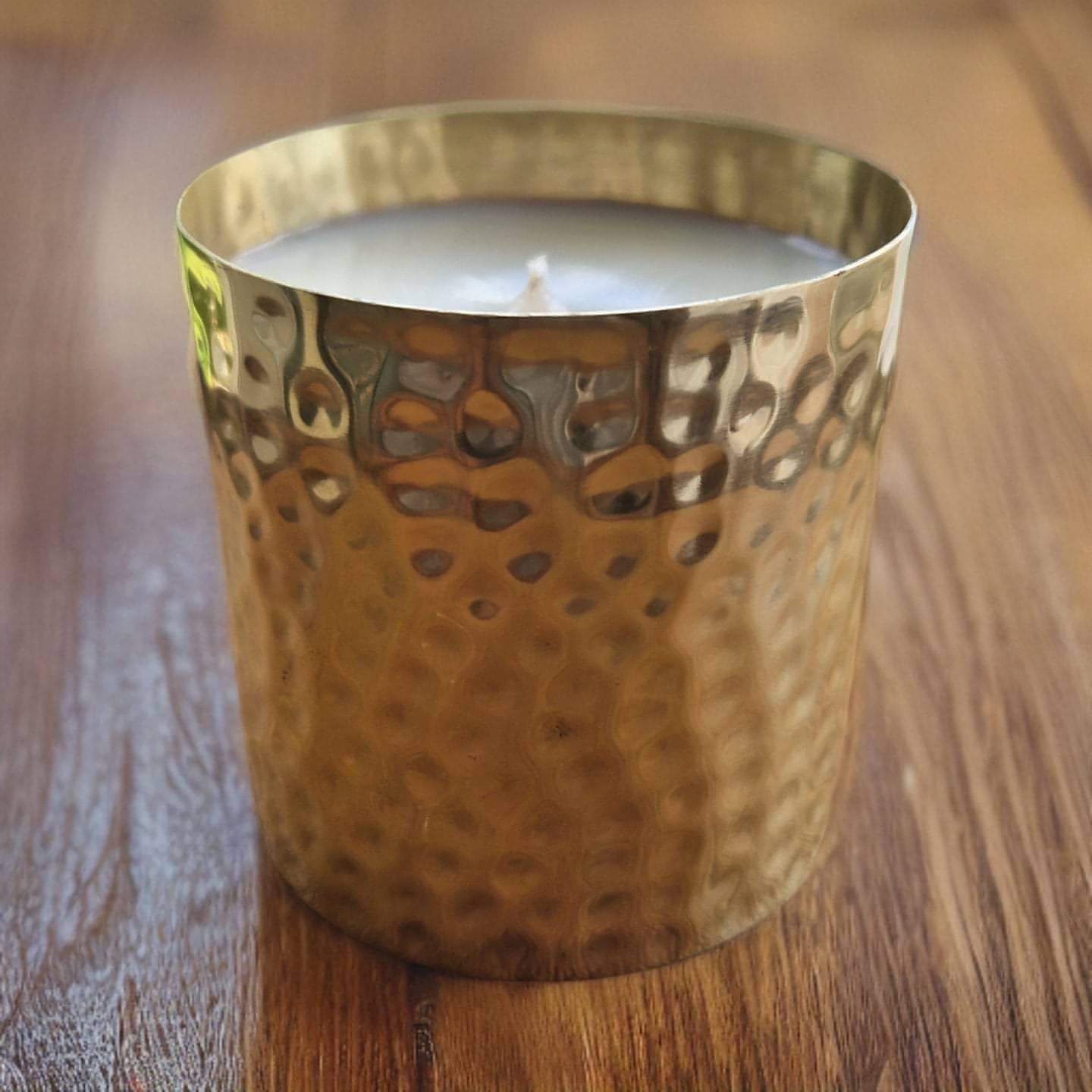 unscented candle in gold hammered tin