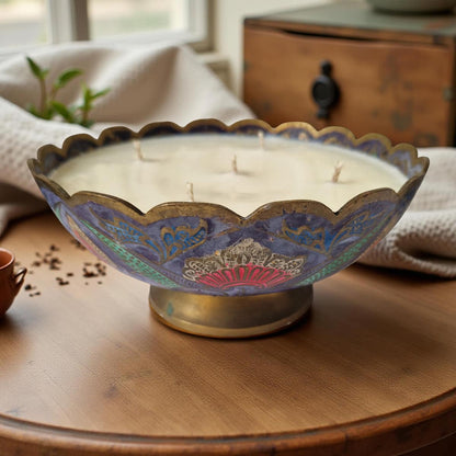 Decorative candle in a decorative holder on a wooden surface