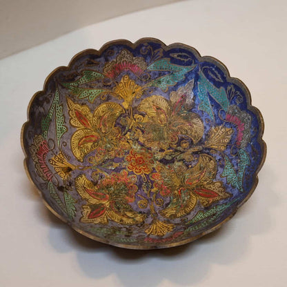 Decorative bowl with intricate floral patterns on a white background