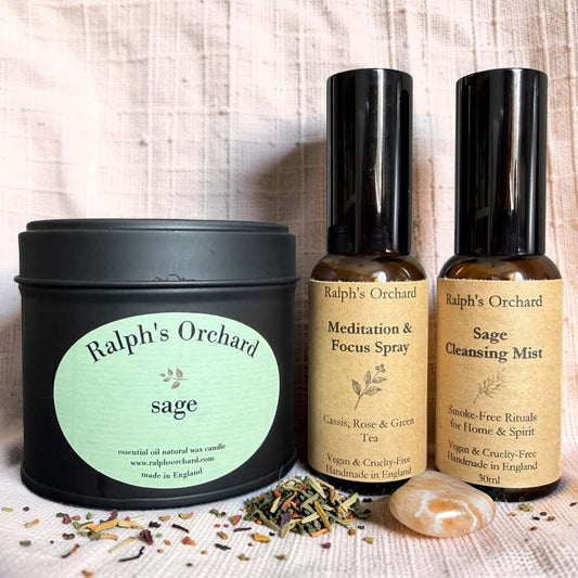 Ralph's Orchard sage candle and spray bottles on a textured surface