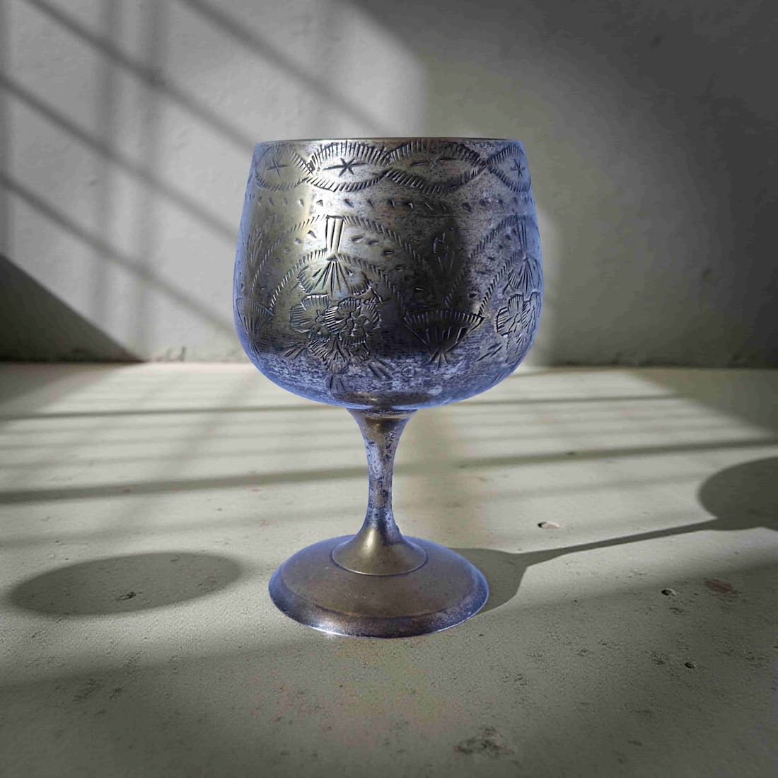 Decorative glass with engraved patterns on a textured surface