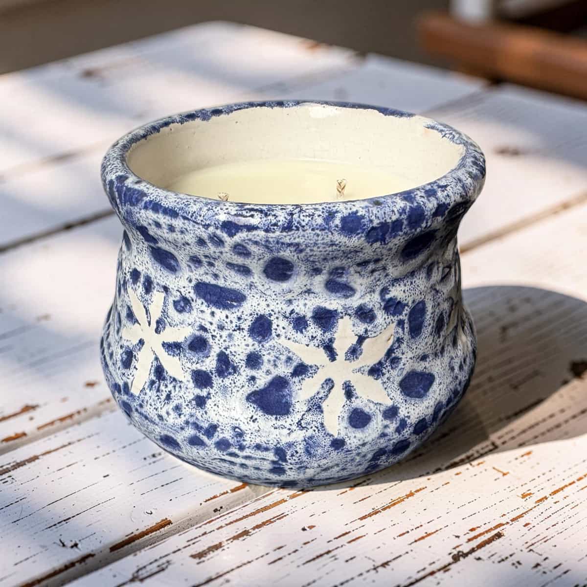 Blue and white ceramic pot on a wooden surface