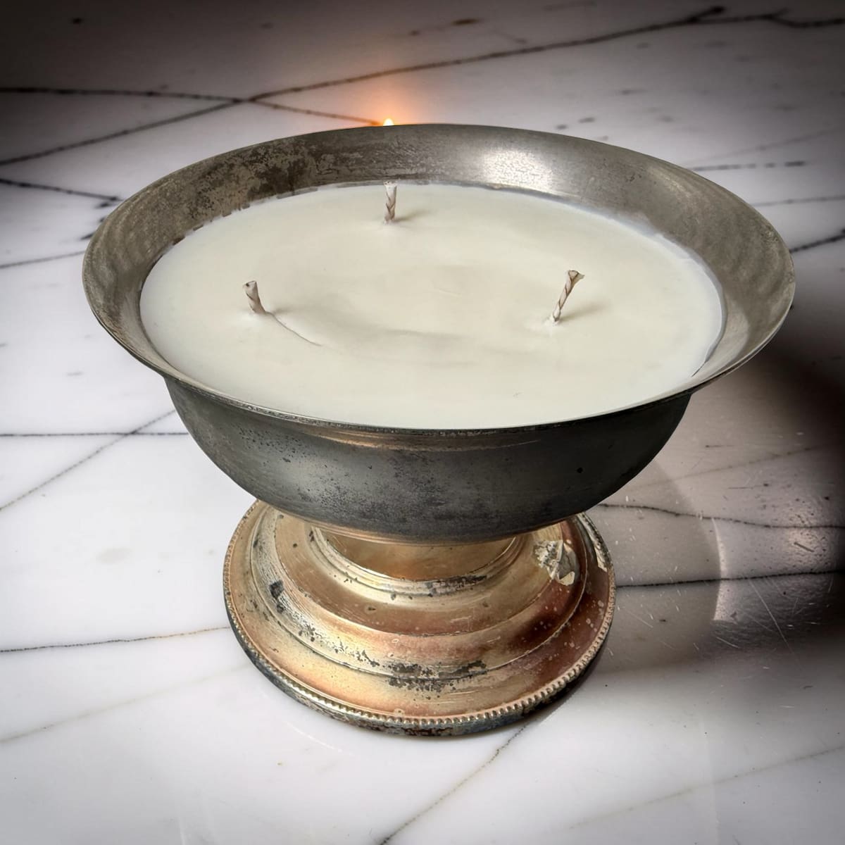 A repurposed vintage metal bowl, hand-poured with our warmly sensual Velvet Tonka fragrance and three cotton wicks.