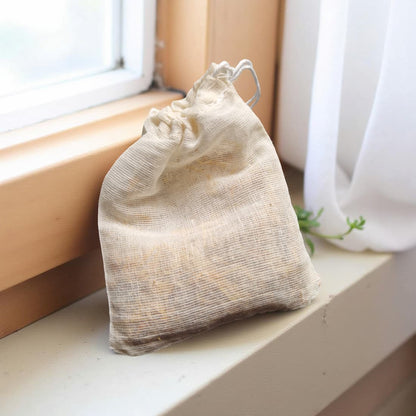 Drawstring bag on a windowsill with natural light