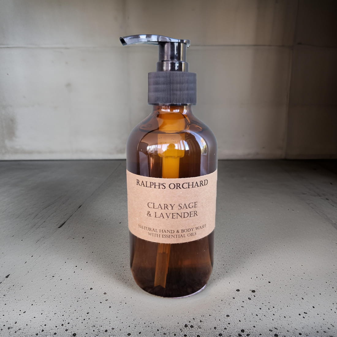 Bottle of Ralph's Orchard Clary Sage & Lavender product on a concrete surface