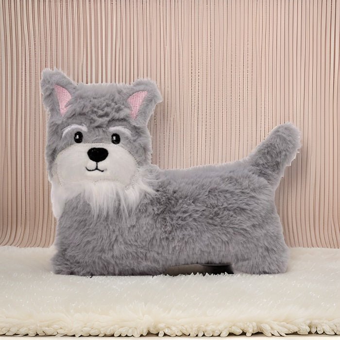 Gray wolf-shaped pillow on a beige blanket with a striped background