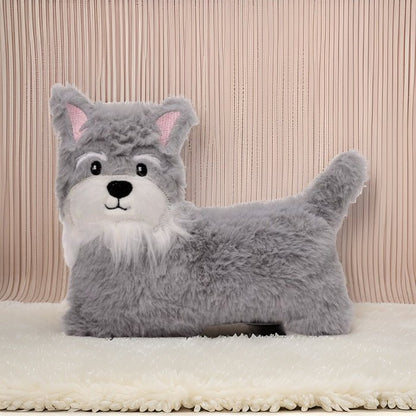 Gray wolf-shaped pillow on a beige blanket with a striped background