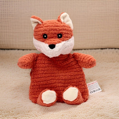 Crocheted fox plush toy on a beige carpet