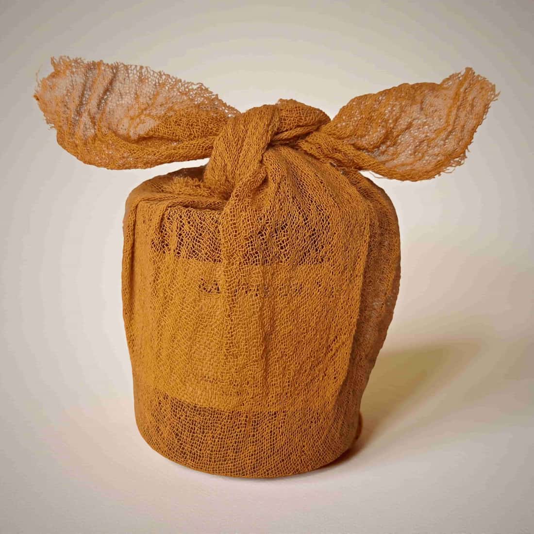 Brown gauze wrap with ears on a light background