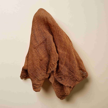Brown towel on a beige background