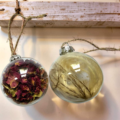 Rose petal and pampas dried flower baubles hanging together by jute twine