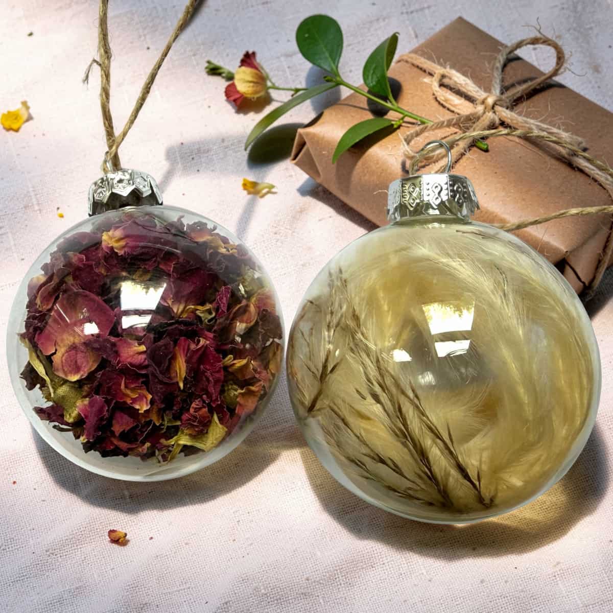Rose petal and pampas dried flower baubles hanging together by jute twine