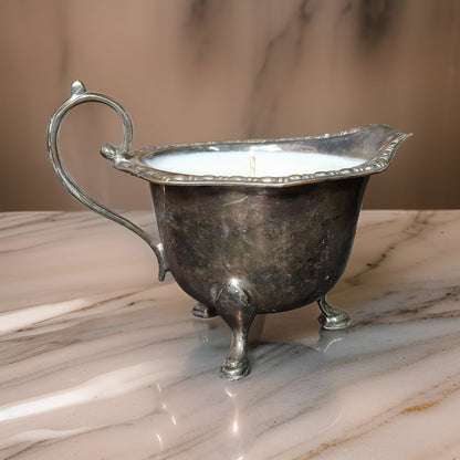 Silver gravy boat on a marble surface