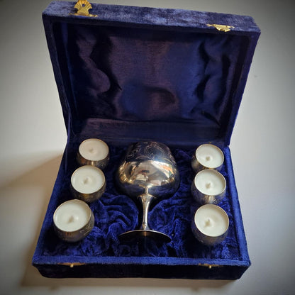 Silver goblet with seven candles in a blue velvet box