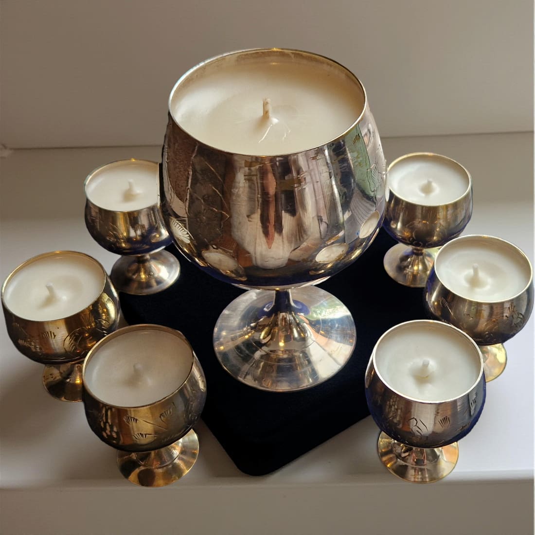 Set of Silver candles on a neutral background