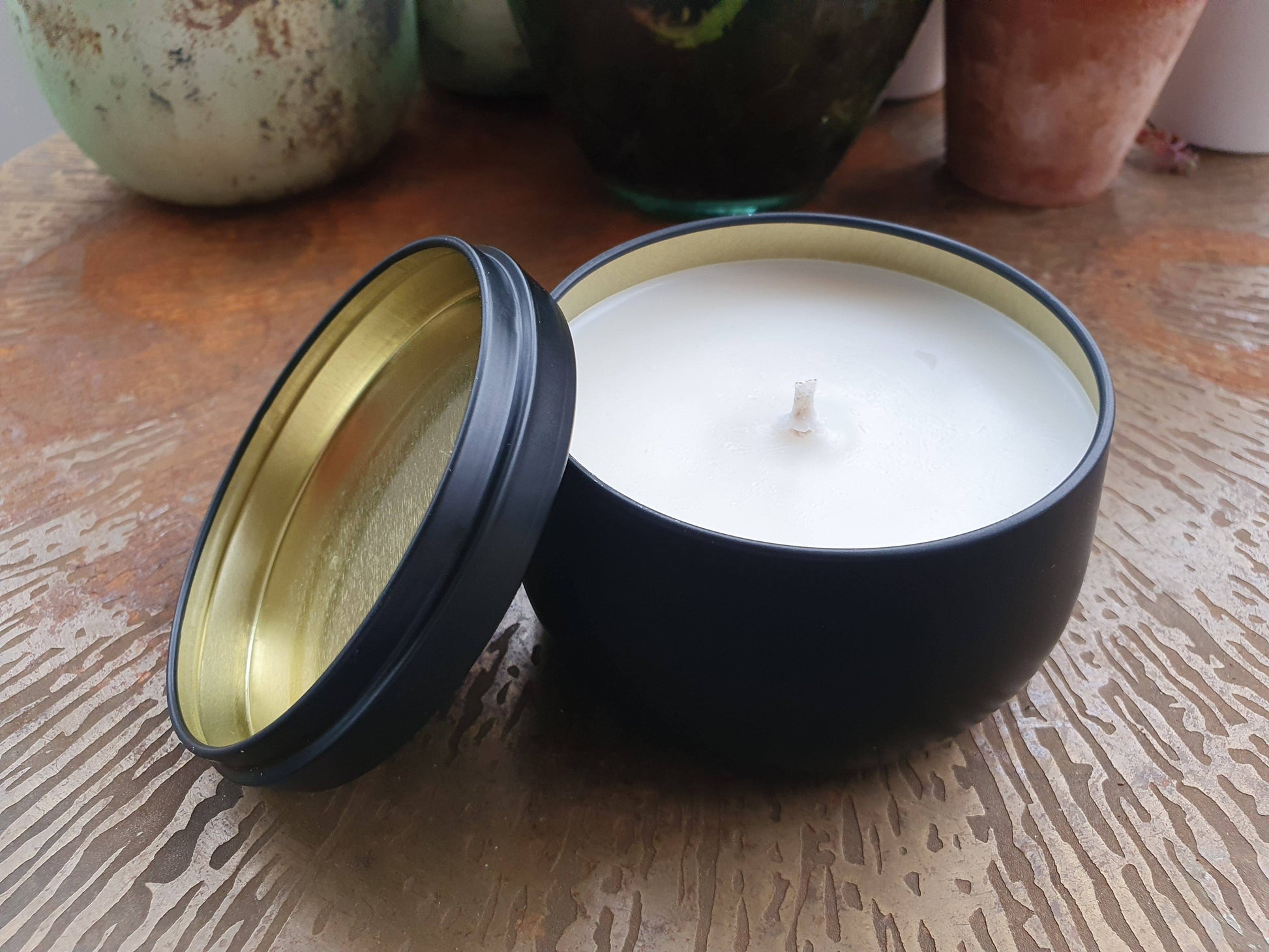 Amber & Rock Salt scenetd candle in black tin