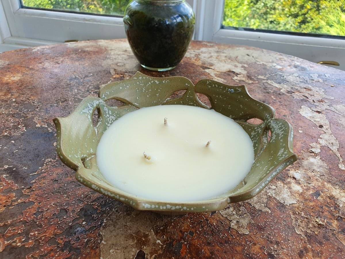 green ceramic flower shaped bowl candle with 3 wicks