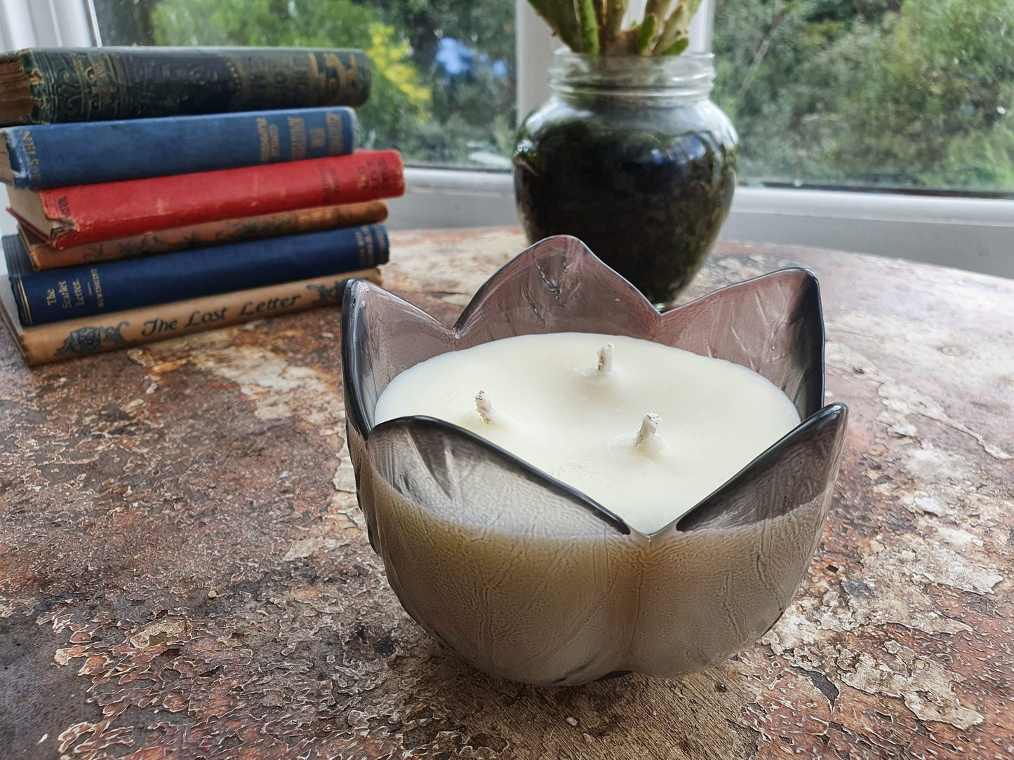 tinted glass flower candle with 3 wicks